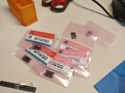 Small black circuit boards in pink bags with different labels reading 'ENGINEERING SAMPLE - NOT FOR SALE.'